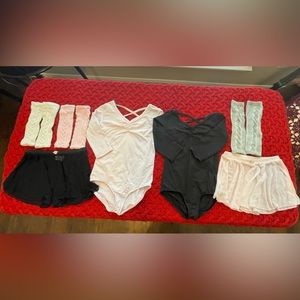 (Set) Danskin dance leotards, skirts and leg warmers for little girls.